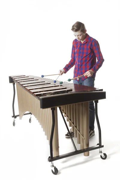 Teenage boy playing marimba in studio — Stock Photo, Image