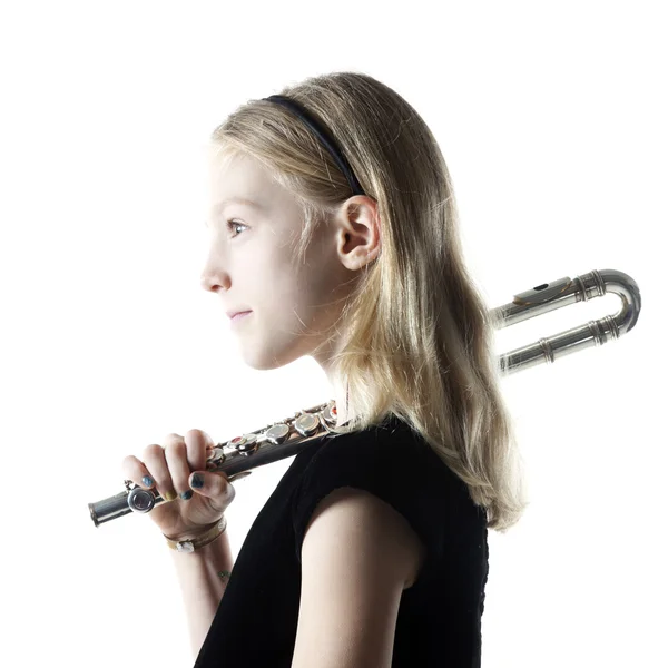 Young blond girl holds flute in studio — Stock Photo, Image