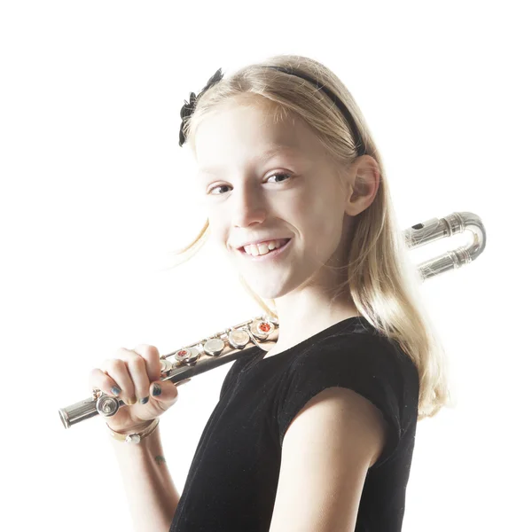 Young blond girl holds flute in studio — Stock Photo, Image