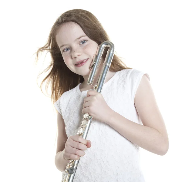 Young red haired girl holds flute in studio — Stock Photo, Image