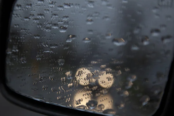 Droplets on rear view mirror of car — Stock Photo, Image