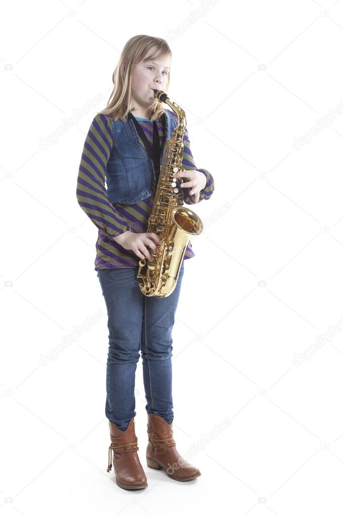 Young blond girl with alto saxophone in studio