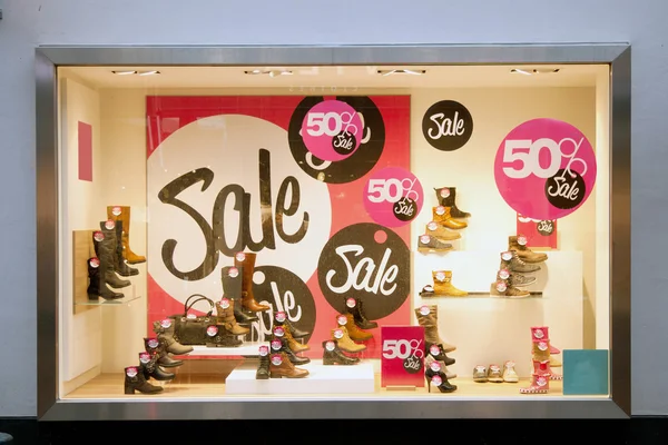 Sale in shop window of shoe shop — Stock Photo, Image