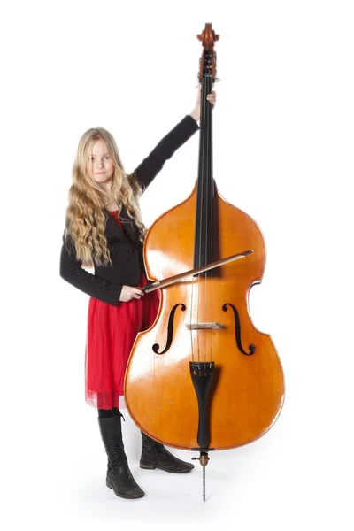 Young girl plays double bass in studio — Stock Photo, Image