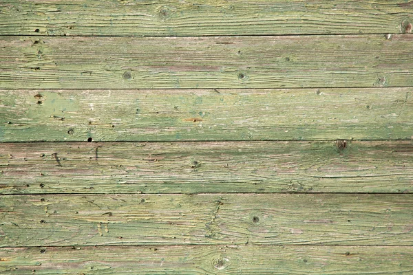 Oude planken met groene verf peeling — Stockfoto