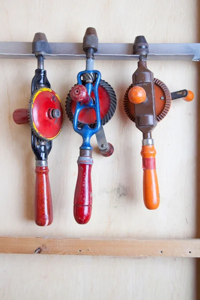 Three old fashioned drills in closet — Stock Photo, Image