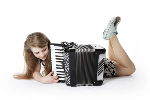 Adolescente no chão do estúdio com acordeão — Fotografia de Stock