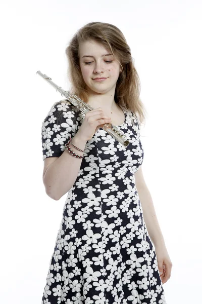 Adolescente no vestido detém flauta no estúdio — Fotografia de Stock