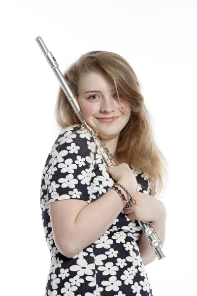 Teenage girl in dress holds flute in studio — Stock Photo, Image