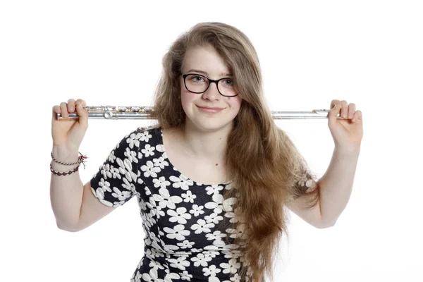 Blond teenage girl holds flute in studio — Stock Photo, Image