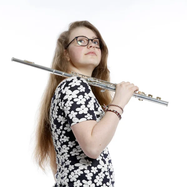 Blond teenage girl with glasses holds flute in studio — Stock Photo, Image