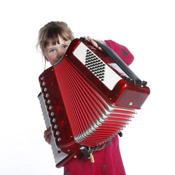 Very young girl with accordion in studio — Stock Photo, Image