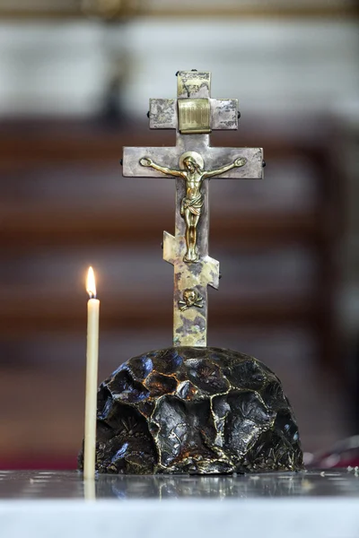 Jesus on the cross with candle burning — Stock fotografie