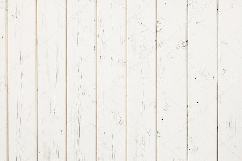 white fence made out of wooden planks