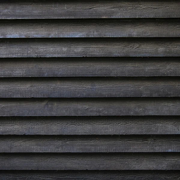 Square part of black wooden fence or part of barn — Stock Photo, Image