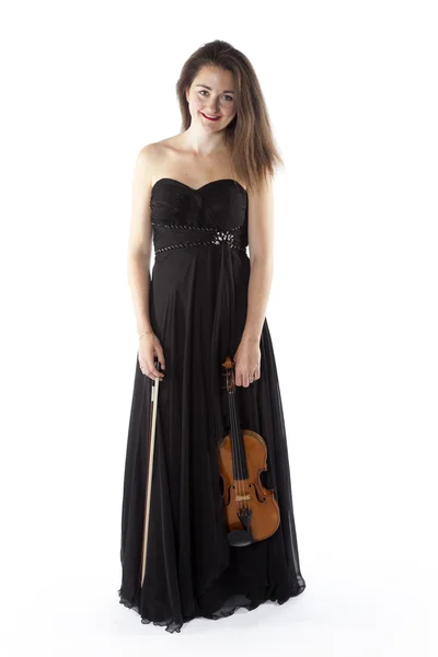 Brunette holds violin in studio against white background — 스톡 사진