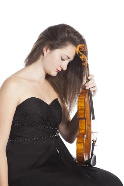 Pensive female violinist in black dress against white background — 스톡 사진
