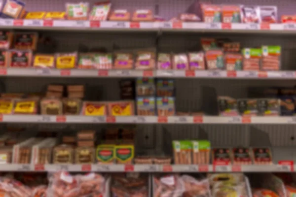 Assorted Sausages Shelves Supermarket Blurred Front View — Stock Photo, Image