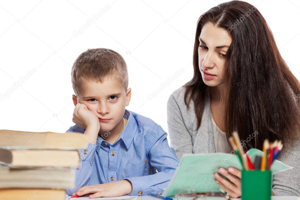 Mom and son are doing their homework. Learning problems. Coronavirus pandemic. Isolated on white background.