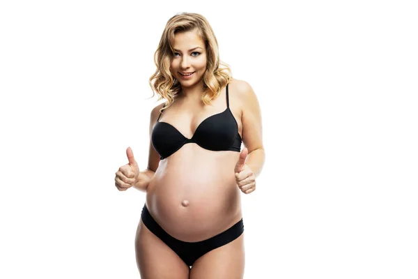 Mujer Rubia Embarazada Sonriente Ropa Interior Negra Mostrando Los Pulgares —  Fotos de Stock