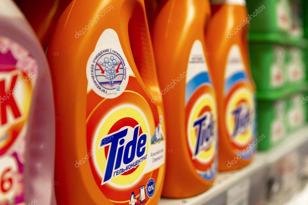 Tide washing powder on the shelf in the store. Close-up. Side view. Moscow, Russia, 01-01-2021.