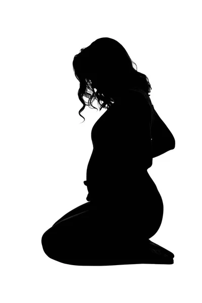 一个孕妇的轮廓 被白色背景隔离 垂直方向 — 图库照片