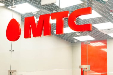 MTS sign. Official sales office of a major mobile operator. Close-up. Moscow, Russia, 03-31-2021. clipart