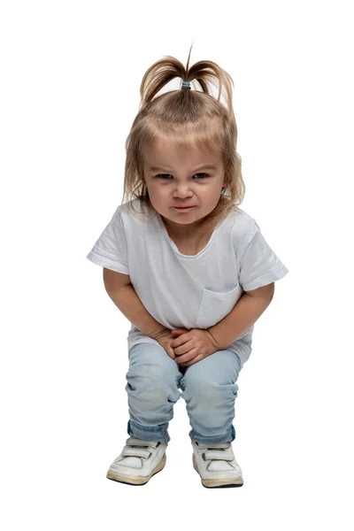 Angry Little Girl Years Old Jeans Squatting Isolated White Background — Stock Photo, Image