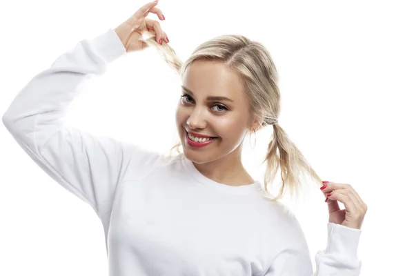 Young Woman Laughs Pretty Blonde Ponytails White Sweater White Background — Photo