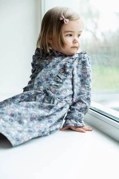Little Girl Sitting Window Child Dress Floral Print Vertical — Stock Photo, Image