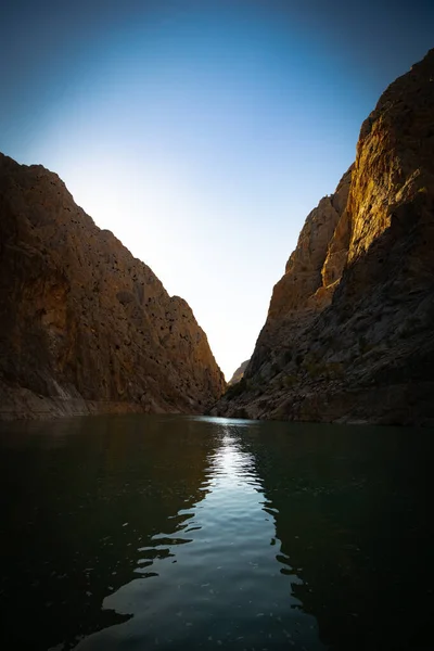 Boat tour on the river and cliffs of a canyon