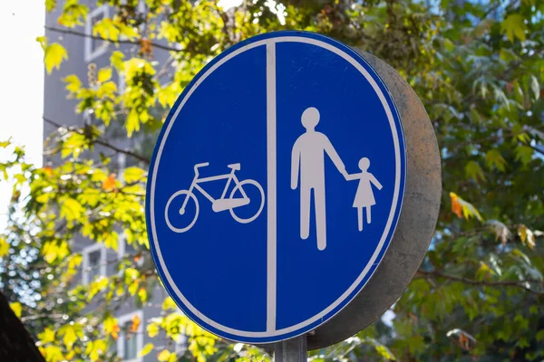 Pedestrian and bike road sign in the city. Bike road sign.