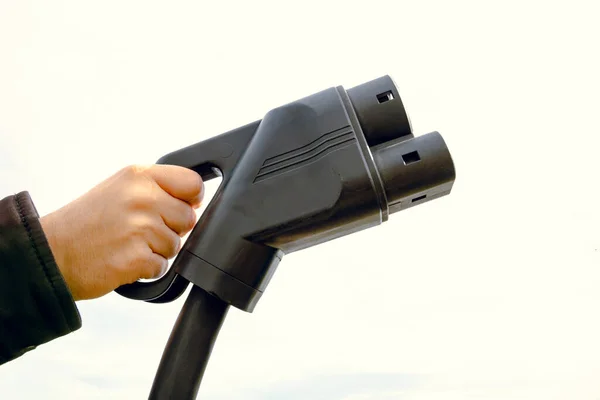 Man Holding Charger Cloudy Sky Copy Space Charger Electric Vehicle — Stock Photo, Image