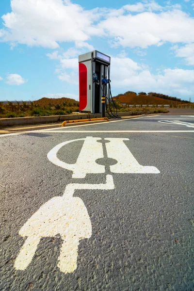 EV charging station with no cars and parking lots with ev charging icons