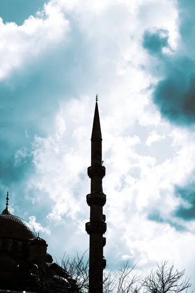 Silhouette of the mosque with cloudy sky. Islamic background photo. Yeni Cami in Istanbul. Ramadan, kandil, iftar, laylat al-qadr, islamic new year background photo.