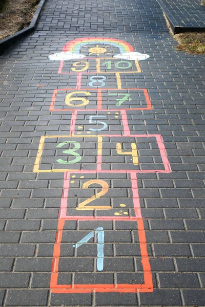 Hopscotch. A game for children. Vertically framed shot.