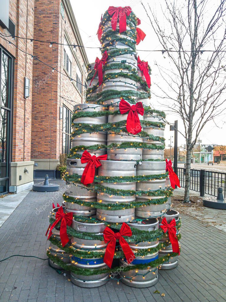 Christmas tree made of upcycled metal drums on the street in front of buildings