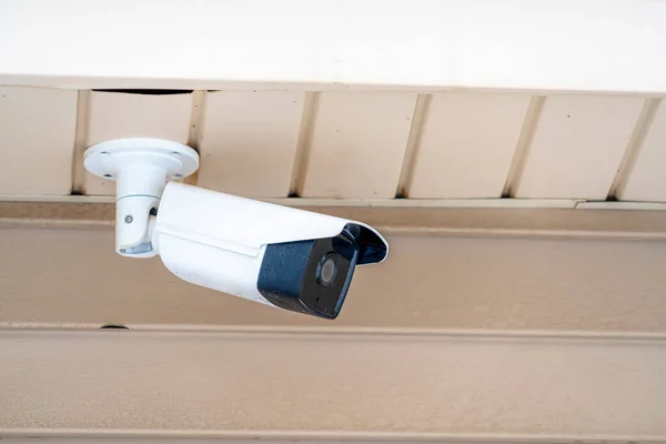 Close up of bullet type surveillance camera on the ceiling of a building — Stock Photo, Image