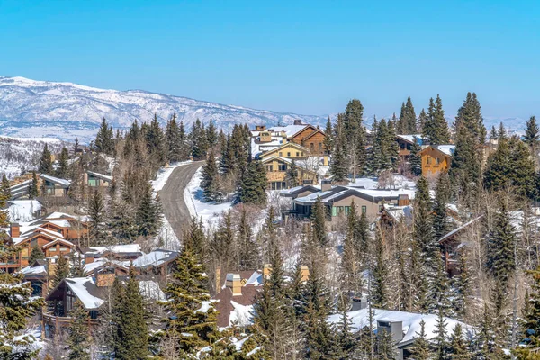 Mountain in Park City Utah on a snowy winter setting with residential community