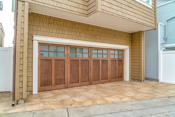 Glass paned wooden door of an attached garage of house in Long Beach California