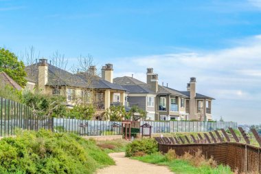 Beautiful houses against cloudy sky background in Huntington Beach California