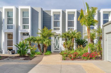 Facade of modern townhomes in Huntington Beach California on a sunny day view