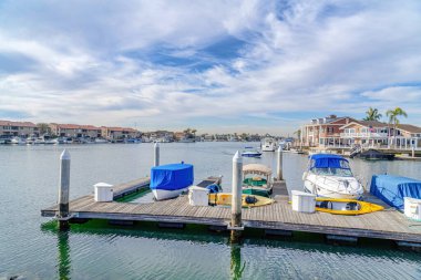 Boats and yachts on the docks of scenic harbor in Huntington Beach California