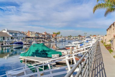 Yachts and boats on docks at stunning harbour of Huntington Beach California