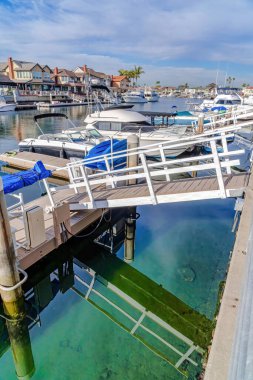 Boats and yachts at harbour docks in Huntington Beach California neighborhood