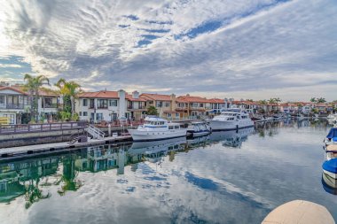 Huntington Beach California on an overcast day with boats and yachts on sea