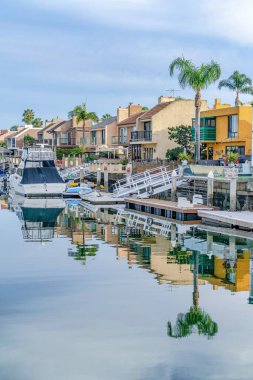 Amazing coastal scenery in Huntington Beach with canal reflecting overcast sky