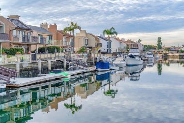 Homes and private docks at the border of canal in Huntington Beach California