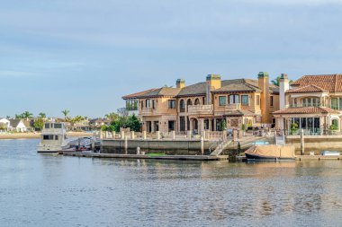 Boats and private yachts of houses overlooking the sea in Huntington Beach CA