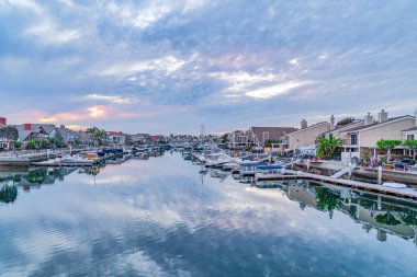 Brilliant landscape of a seaside neighborhood in Huntington Beach CA at sunset